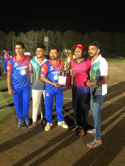Indians Capital players with a trophy alongside players from other teams